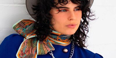 Image of a model wearing a Furious Goose scarf.