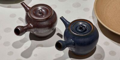Image of two ceramic tea cups.