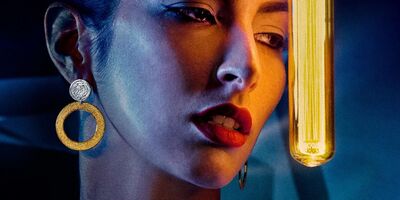 Image of a woman wearing earrings.