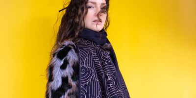 Image of a woman wearing a scarf.