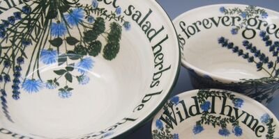 A selection of bowls decorated with blue flowers and words