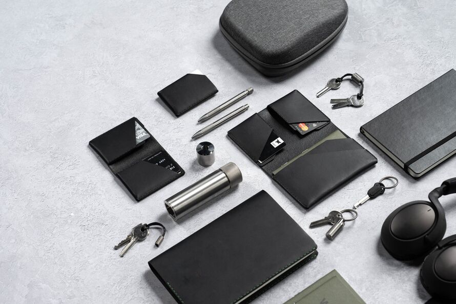 Image of leather wallets and metal stationery.