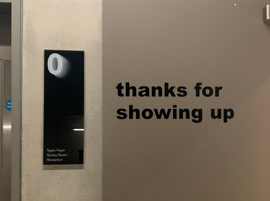 Image of the door saying 'thanks for showing up'